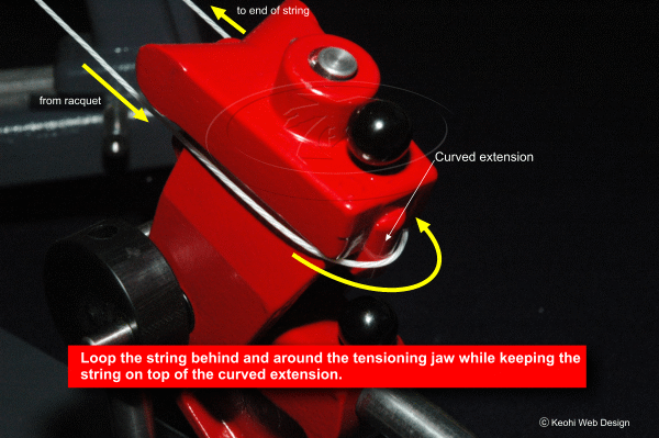 Looping the string behind and around the tensioning jaw
